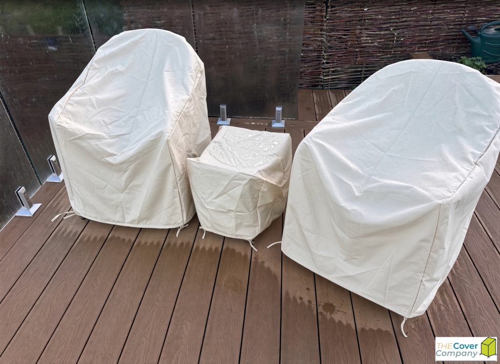 custom-outdoor-chair-covers-australia.jpg Custom made outdoor chair covers and side table cover in cream on a timber deck – The Cover Company Australia