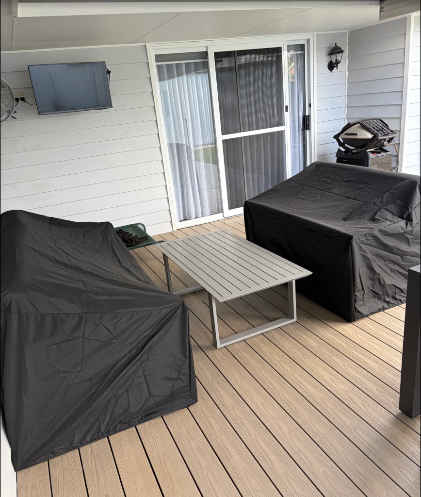 custom-outdoor-sofa-cover-australia.jpg Custom made outdoor sofa covers in charcoal fitted over sofas on a covered deck – The Cover Company Australia