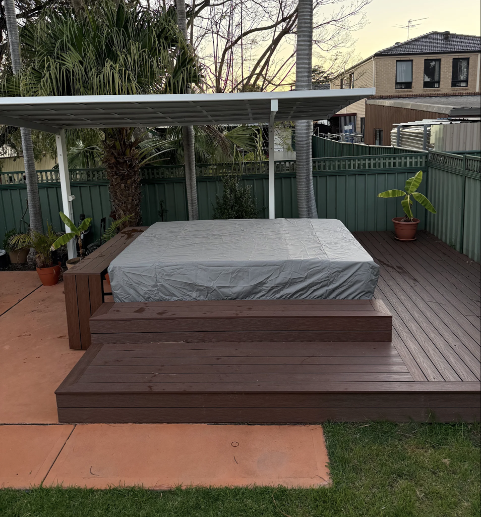 custom-spa-cover-australia.jpg Custom made spa cover in grey fitted over a spa on a raised deck under a pergola – The Cover Company Australia
